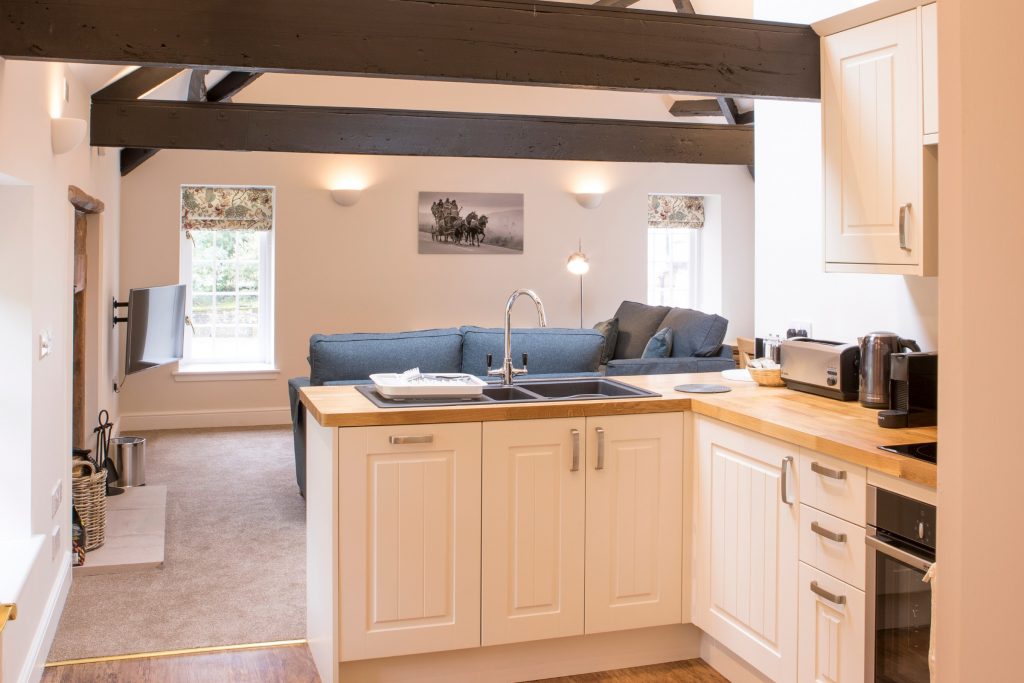 A kitchen with white cabinets

Description automatically generated with medium confidence